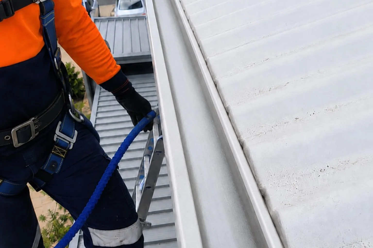 Gutter vacuum clearing leaves from a Perth home gutter