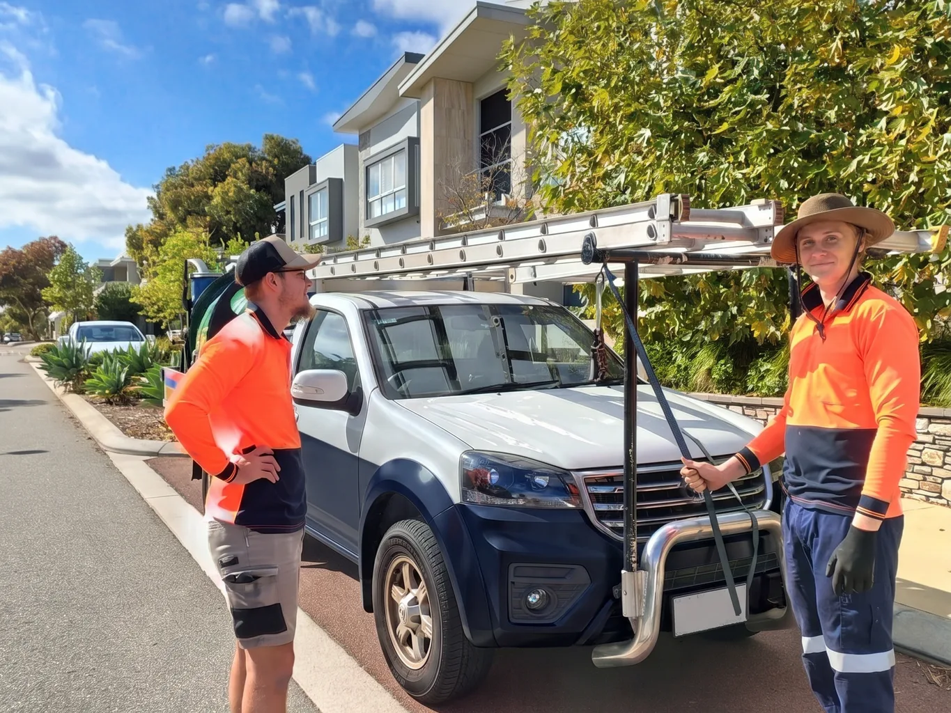 The Perth Gutter Cleaning Pros crew loading up their ute for a gutter cleaning job in Perth